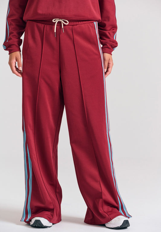 Pantaloni jogger cu croi larg și bandă laterală