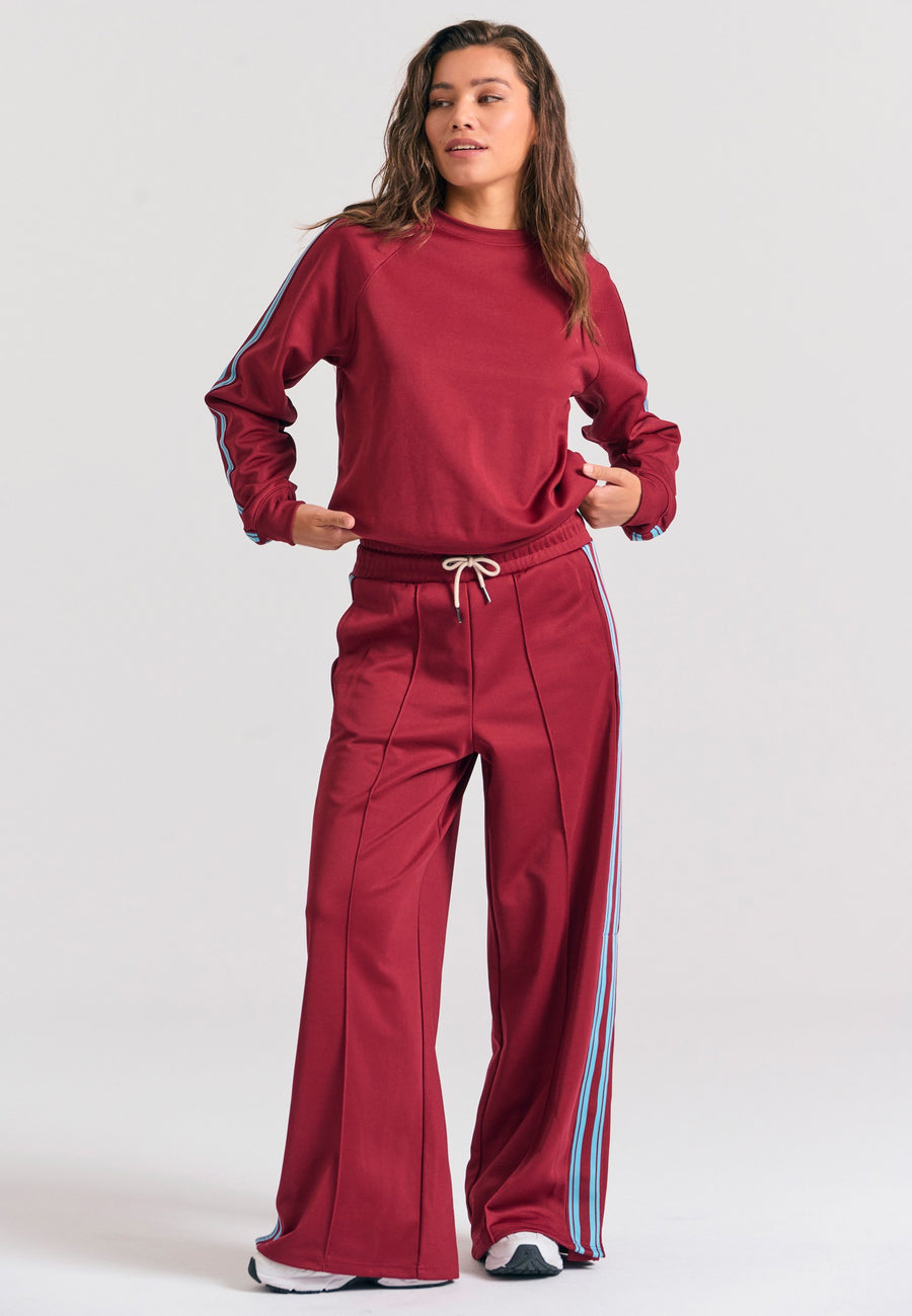 Pantaloni jogger cu croi larg și bandă laterală