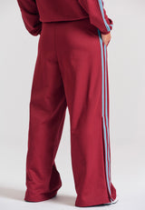 Pantaloni jogger cu croi larg și bandă laterală
