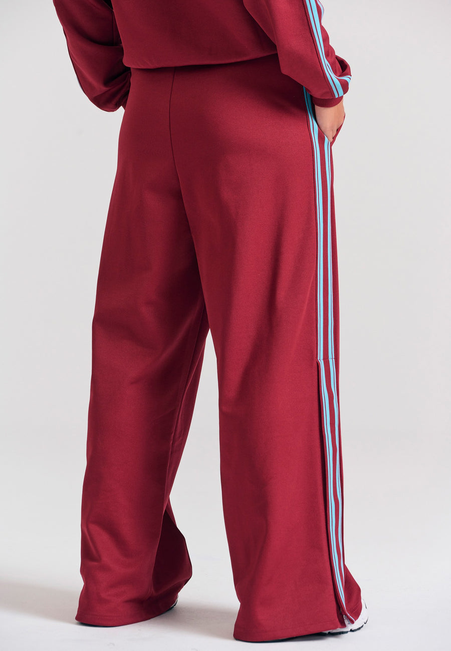 Pantaloni jogger cu croi larg și bandă laterală