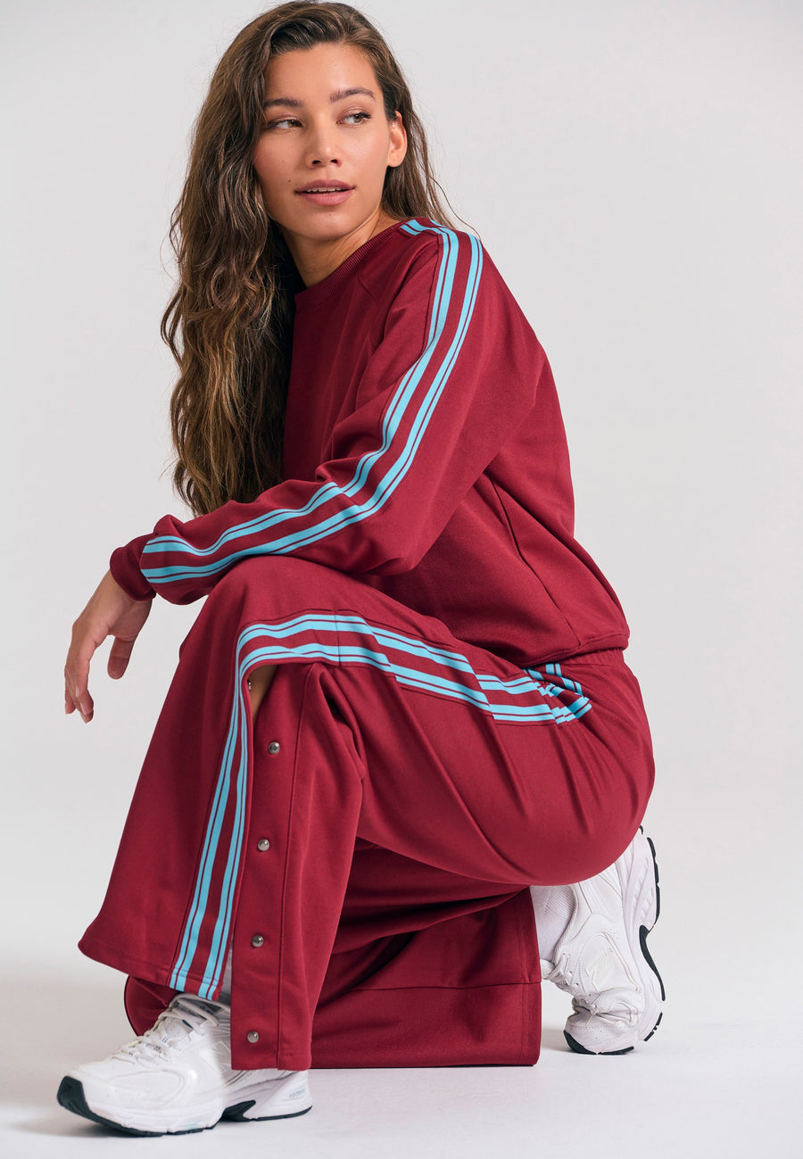 Pantaloni jogger cu croi larg și bandă laterală