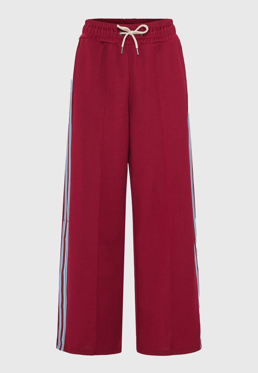 Pantaloni jogger cu croi larg și bandă laterală