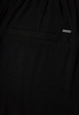 Loose fit artificial silk trousers - Black