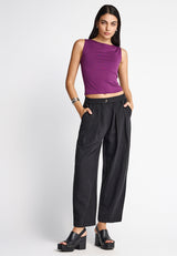 Sleeveless top with high neck