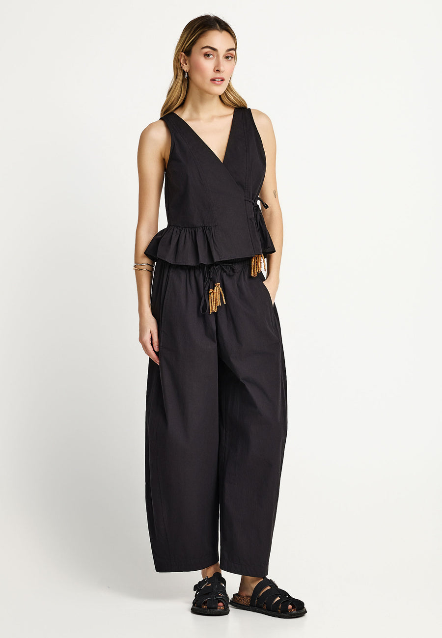 Women's wrapped top with ruffle hem