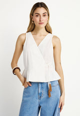 Women's wrapped top with ruffle hem
