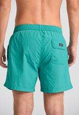 Men's plain swim shorts with decorative pocket - Carribean green