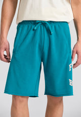 Wide leg fit sports shorts with branded print - Peacock